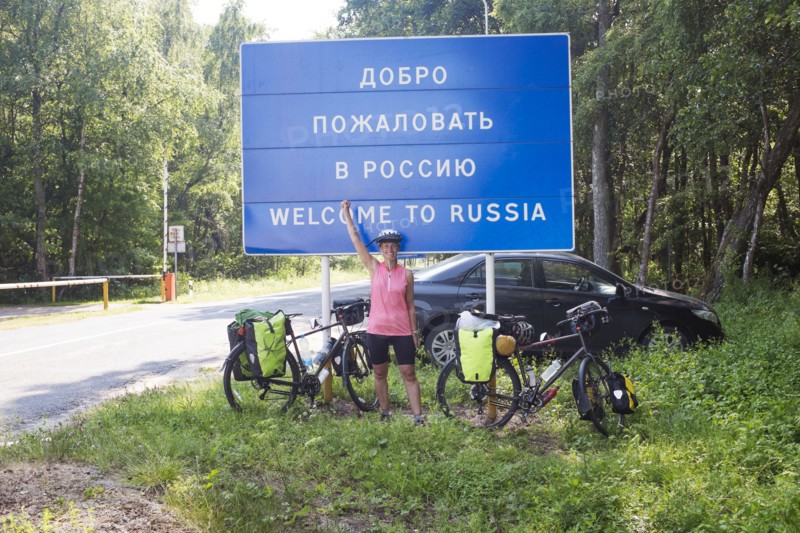 Hispanic biker cheering at Russian border