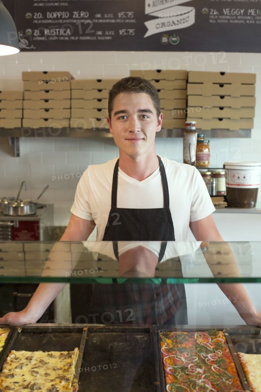 Server smiling in cafe