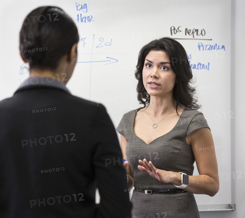 Businesswomen talking in office