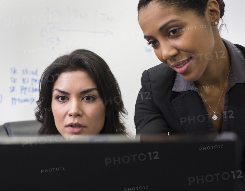 Businesswomen using computer in office