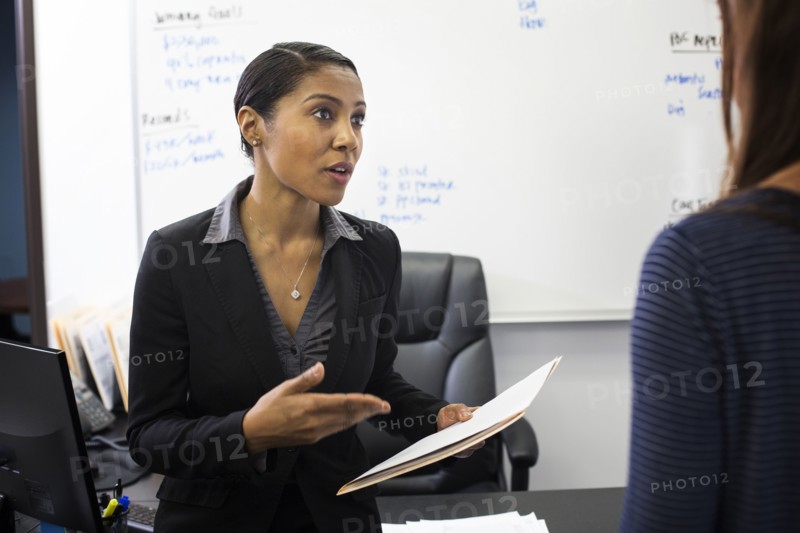 Businesswomen talking in office