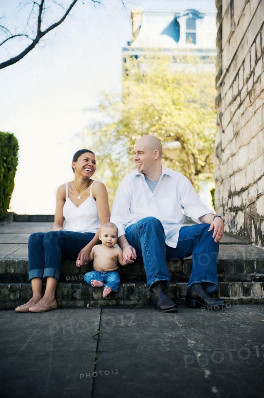 Family sitting on urban park steps