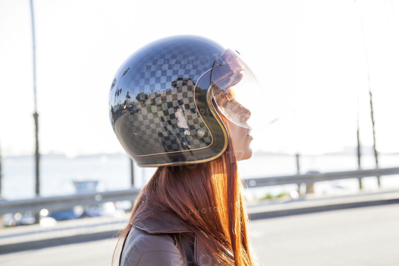 Caucasian woman wearing motorcycle helmet