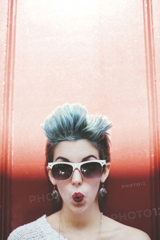 Stylish Caucasian woman with sunglasses and dyed hair