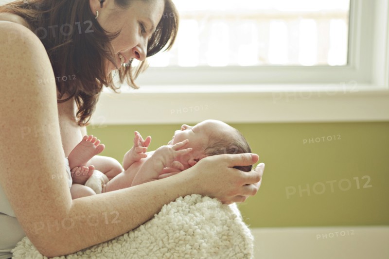 Caucasian mother holding newborn baby