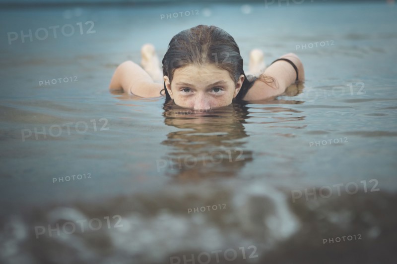 Caucasian girl swimming