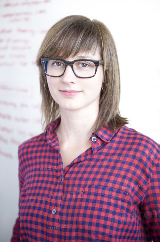 Businesswoman standing at whiteboard in office