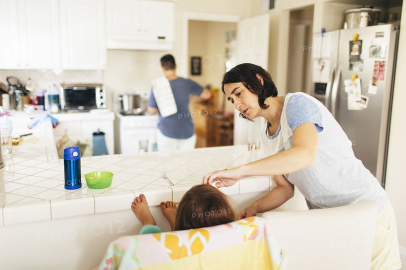 Caucasian family having breakfast in kitchen