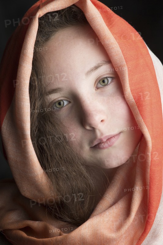 Close up of Caucasian girl wearing headscarf