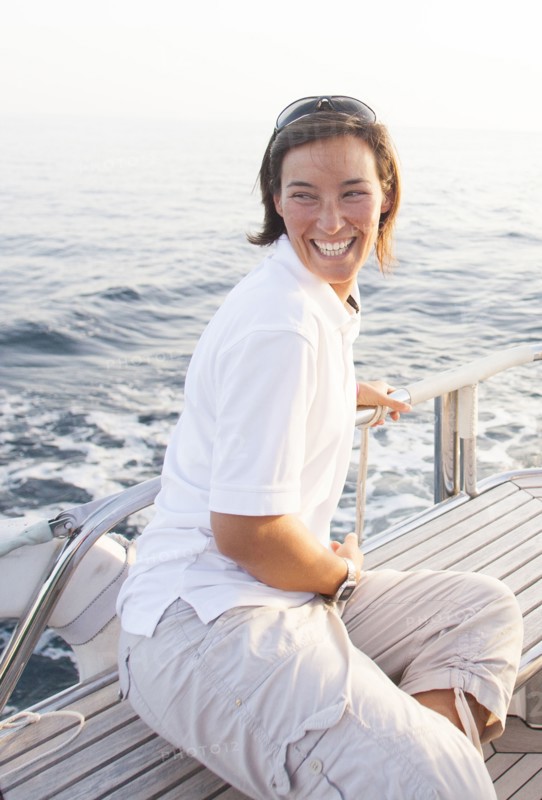 Caucasian woman smiling on boat deck