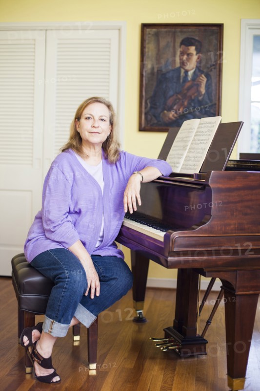 Caucasian musician sitting at piano