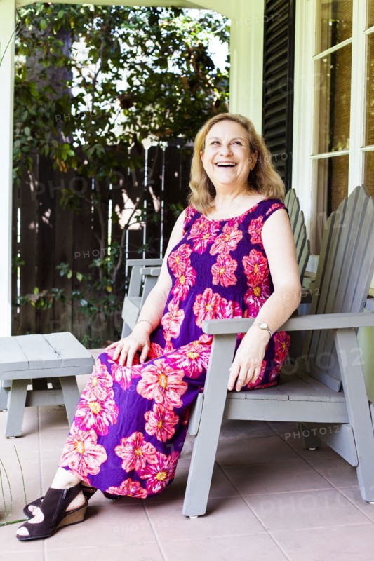 Caucasian woman sitting on porch