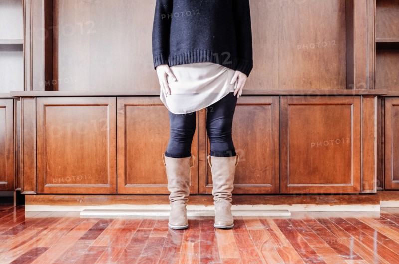 Caucasian woman standing in empty room