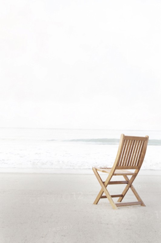 Empty folding chair on beach