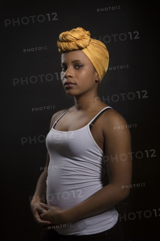 Serious Black woman wearing headwrap