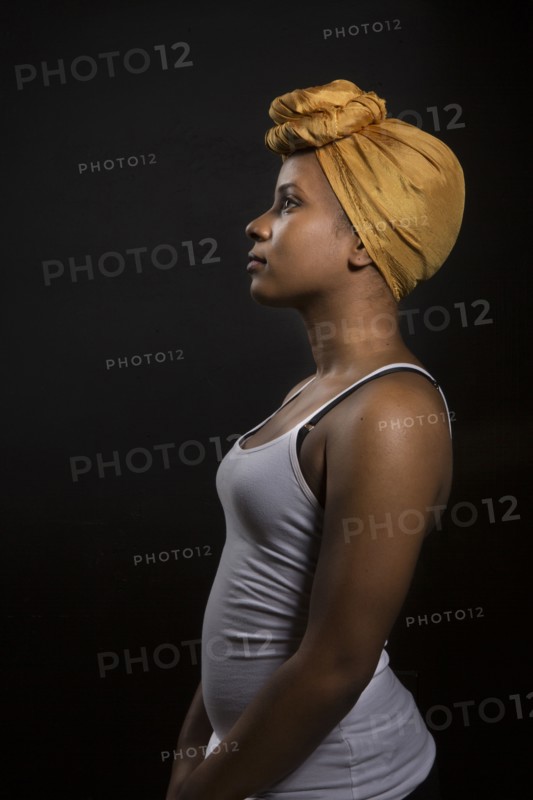 Profile of Black woman wearing headwrap
