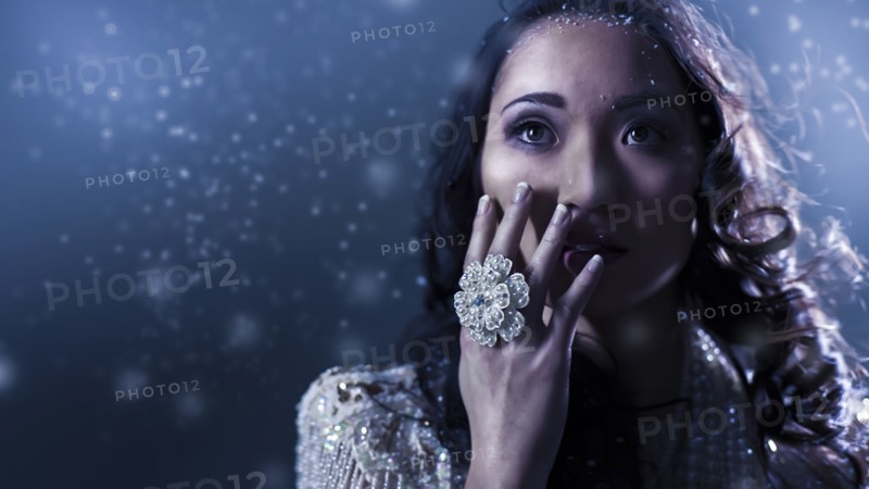 Glamorous Chinese woman covering her face