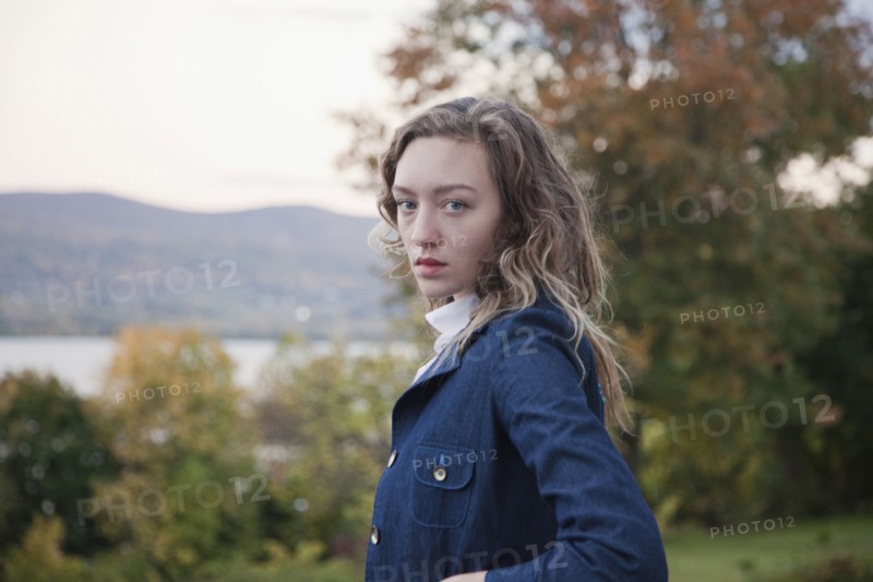 Woman walking outdoors near lake