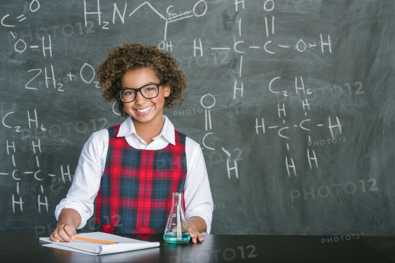 Mixed race student doing experiment in science class