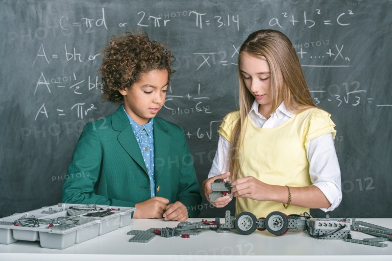 Students building vehicle in science class