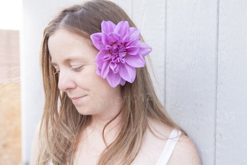 Mixed race woman wearing flower in her hair