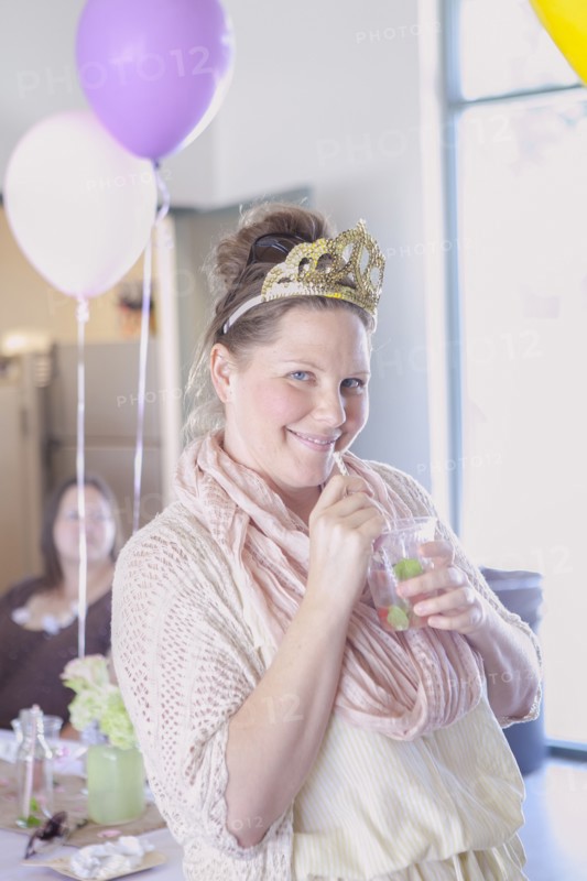 Caucasian woman drinking cocktail at party