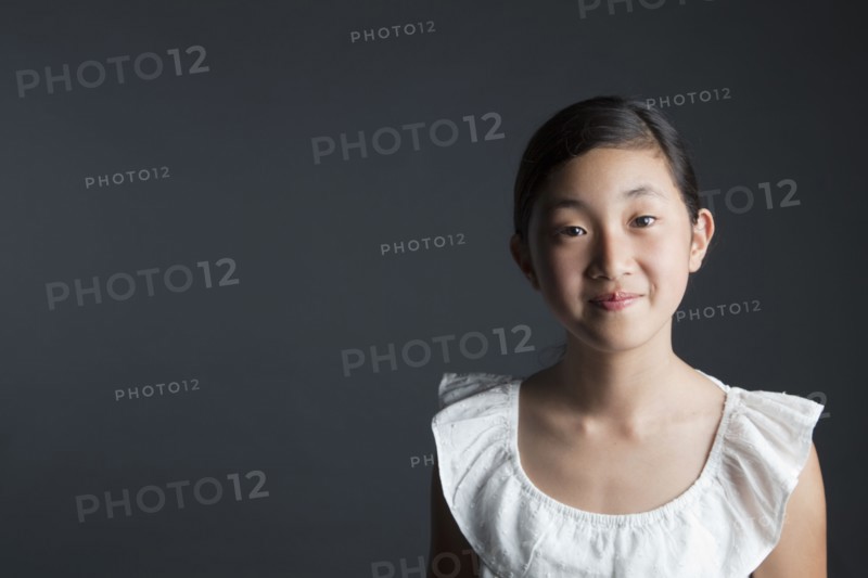 Smiling Asian girl looking at camera