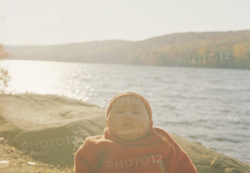 Asian baby girl at remote lake