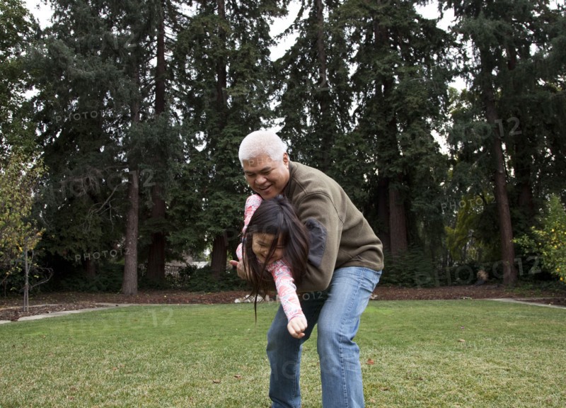 Father and daughter playing in backyard