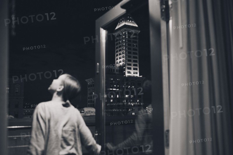 Girl admiring view from balcony doorway