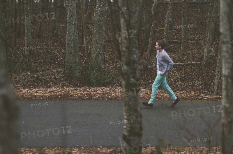 Girl walking on rural road