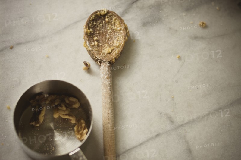 Close up of wooden spoon and measuring cup