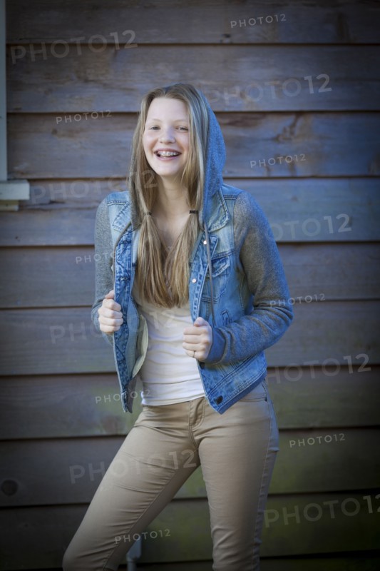 Smiling girl wearing denim jacket