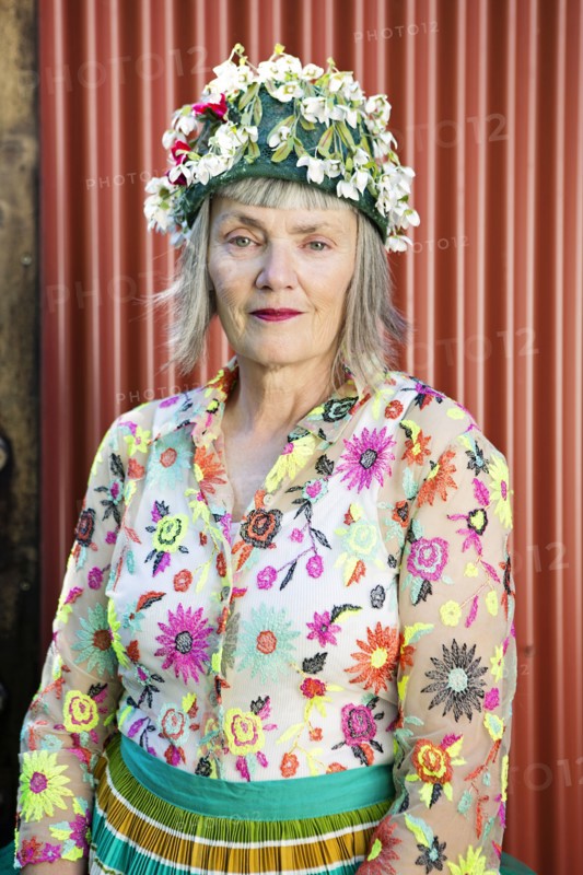 Stylish older Caucasian woman wearing floral cap