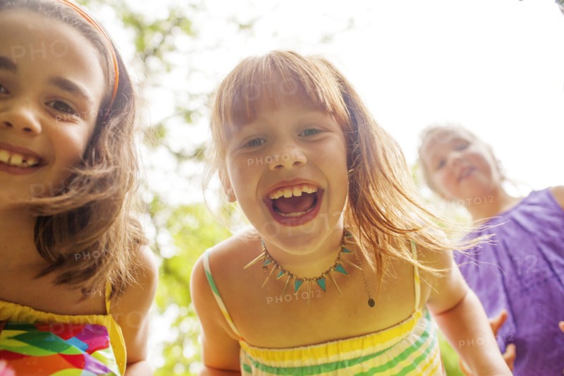 Close up of girls laughing outdoors