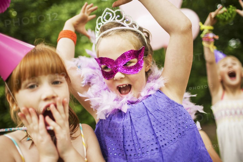 Girls playing dress-up at birthday party