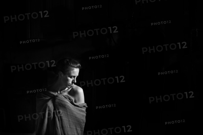 Caucasian woman wrapped in blanket