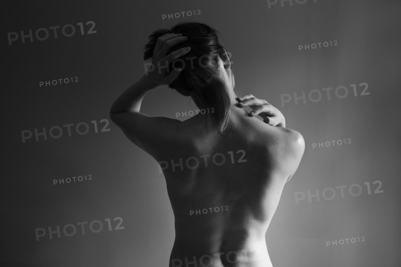 Muscular back of nude Caucasian woman