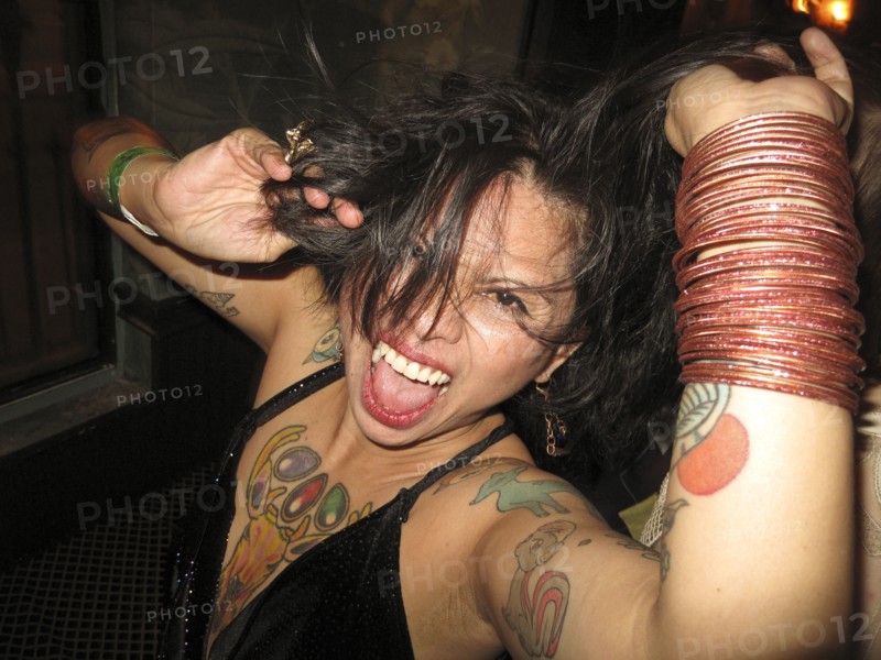 Asian woman dancing at party