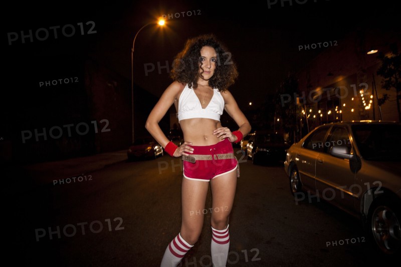 Woman wearing retro costume at night