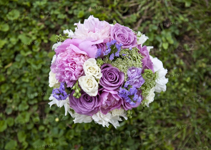 Close up of bouquet of flowers in grass