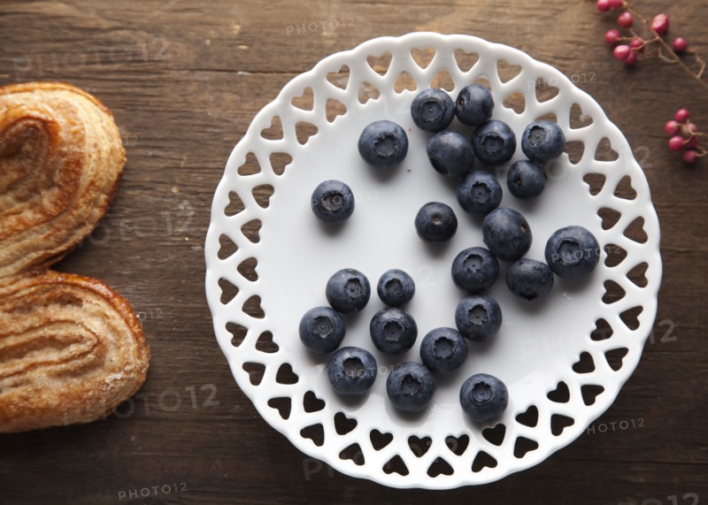 Plate of blueberries with pastry