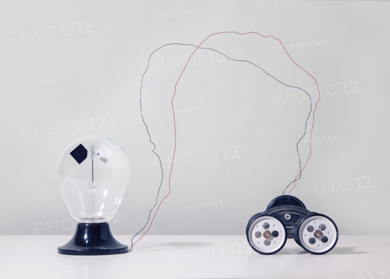 Wire connecting toy car to light bulb