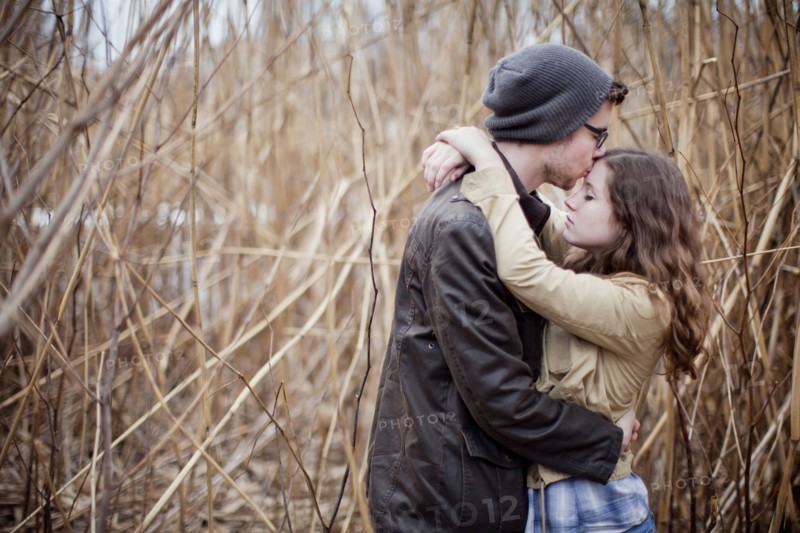 Couple hugging in branches