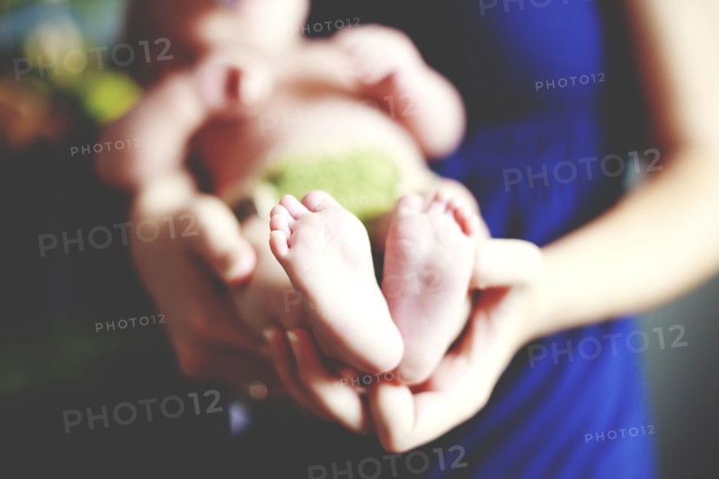 Close up of girl holding baby