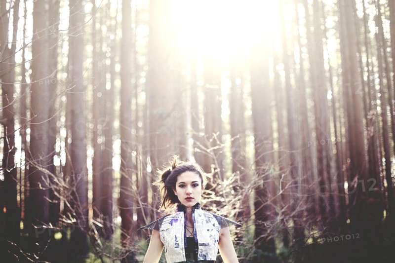 Close up of woman standing under trees