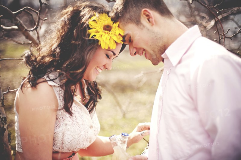 Couple touching foreheads in park