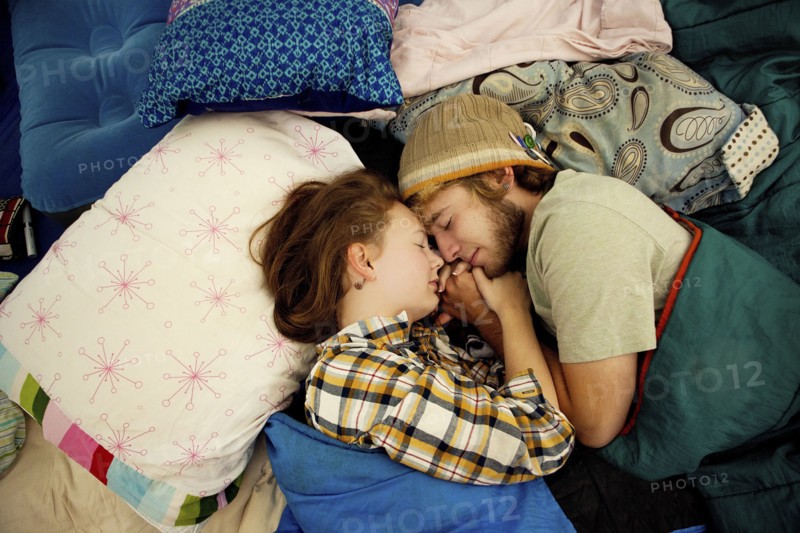 Couple sleeping in camping tent
