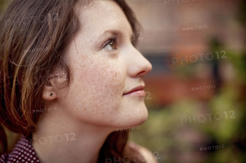 Close up of teenage girl looking up