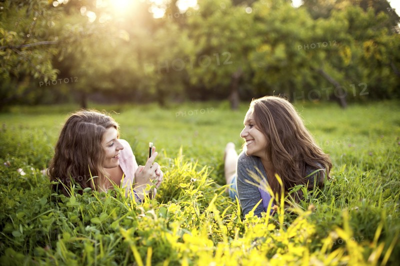 Caucasian women laying in rural field
